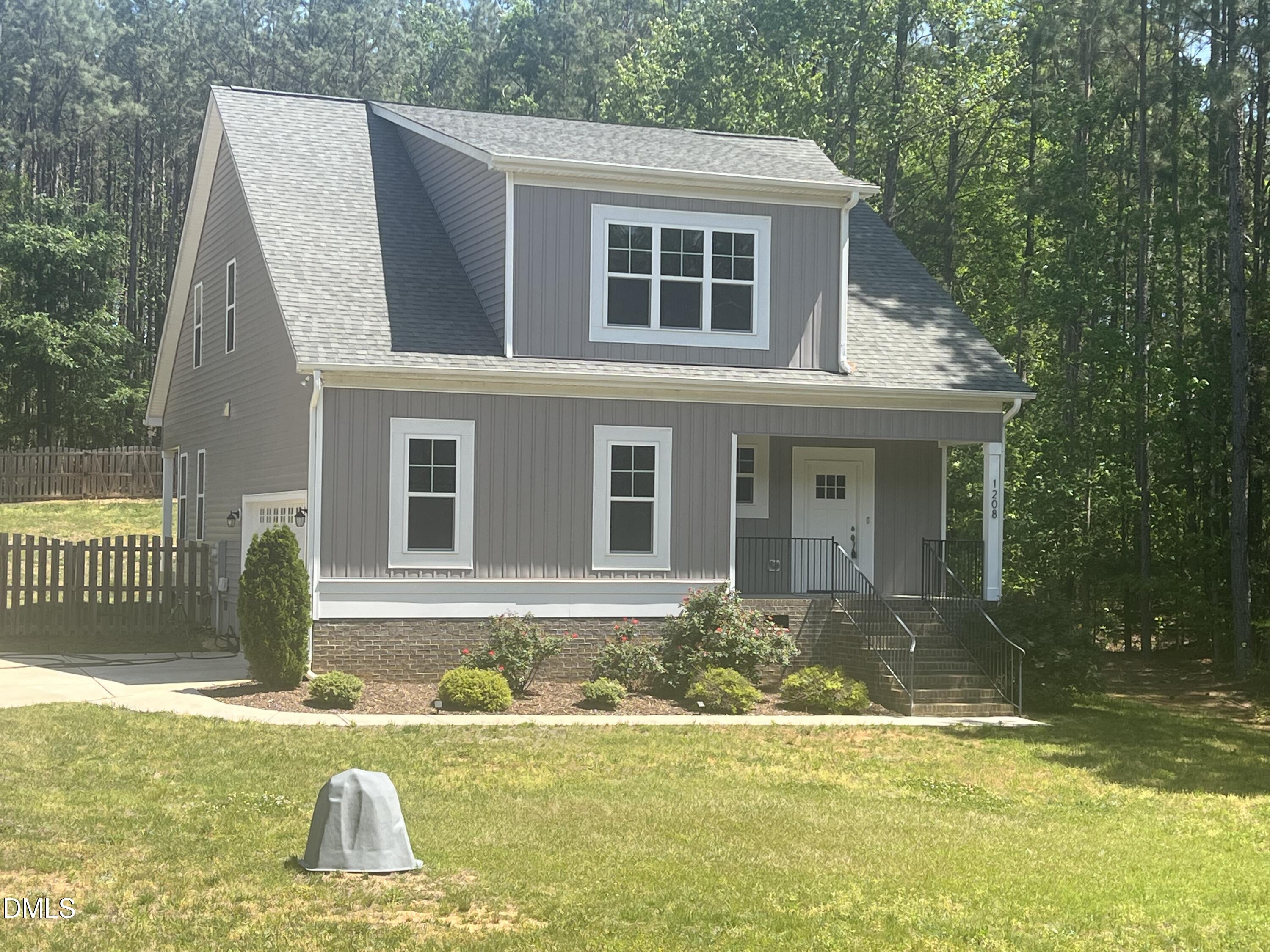 1208 Montgomery Road Franklinton, NC 27525 - Photo 1 of 61 a front view of a house with a yard