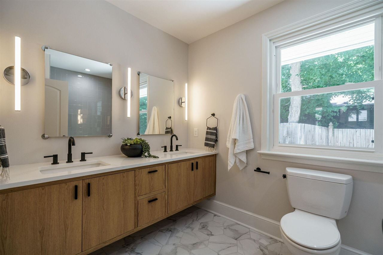 2005 Banbury Road Raleigh, NC 27608 - Photo 24 of 30 Floating Dual Vanity, Lots of Light, Great Bathtub and Luxe Finishes make this a lovely Bathroom serving the secondary Bedrooms. Hall Bath