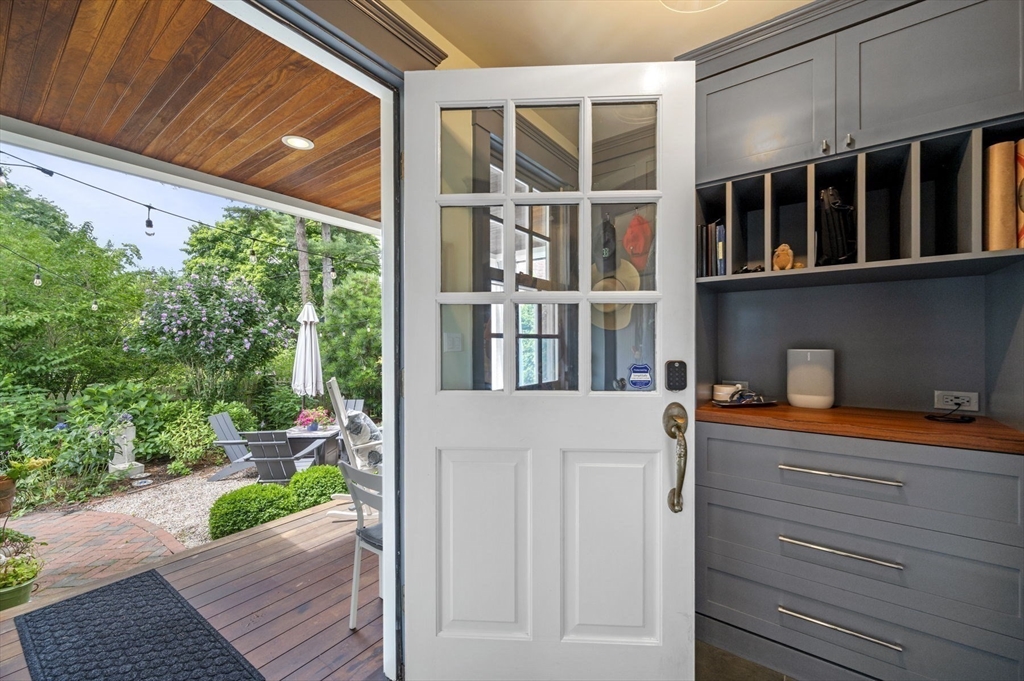 5 Gregory Street Marblehead, MA 01945 - Photo 21 of 29 a backyard of a house with a garden and barbeque oven