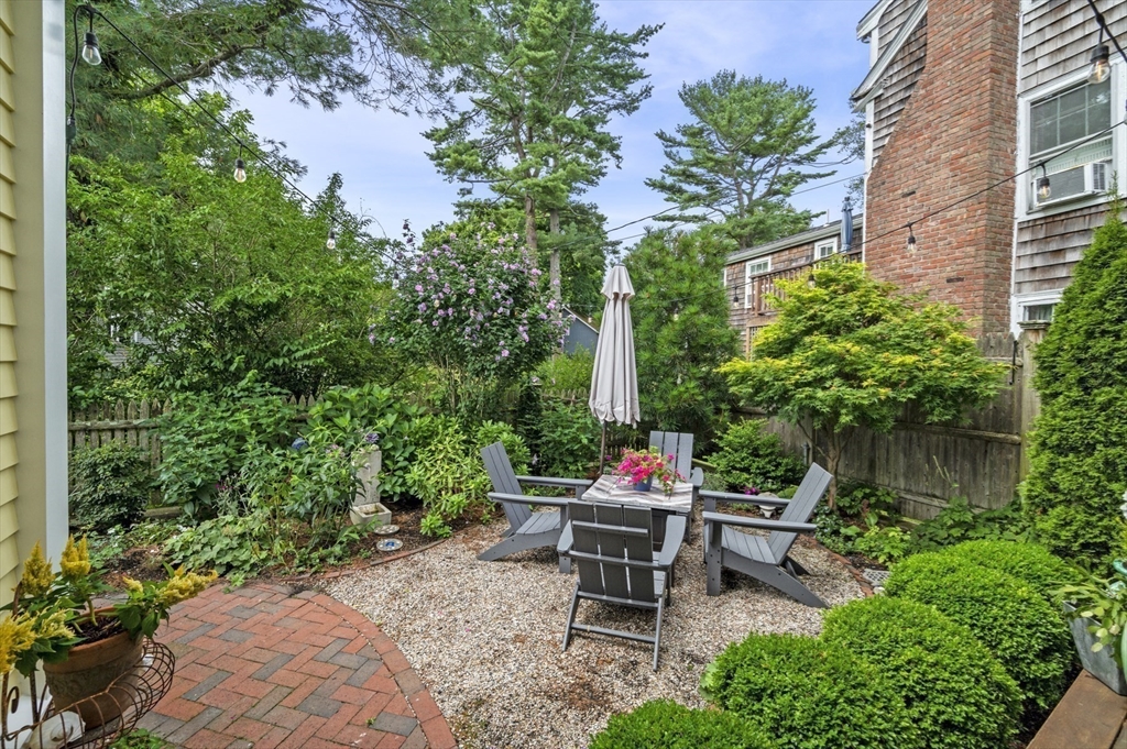 5 Gregory Street Marblehead, MA 01945 - Photo 23 of 29 a view of chair and table in backyard of the house
