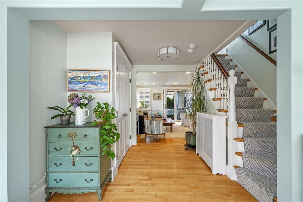 5 Gregory Street Marblehead, MA 01945 - Photo 4 of 29 a view of a hallway with wooden floor and windows