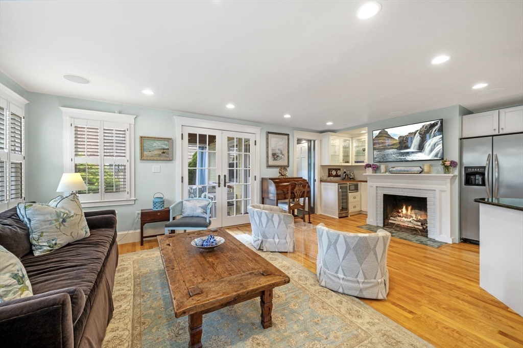 5 Gregory Street Marblehead, MA 01945 - Photo 5 of 29 a living room with furniture a fireplace and a table