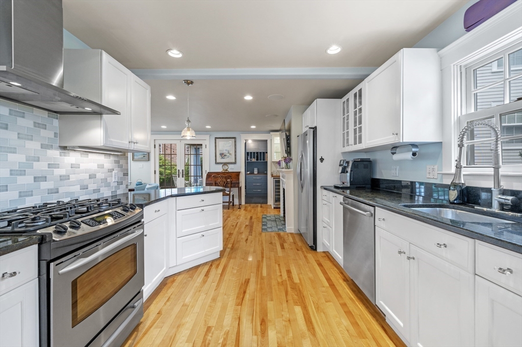 5 Gregory Street Marblehead, MA 01945 - Photo 9 of 29 a large kitchen with stainless steel appliances granite countertop a stove a sink dishwasher and a refrigerator