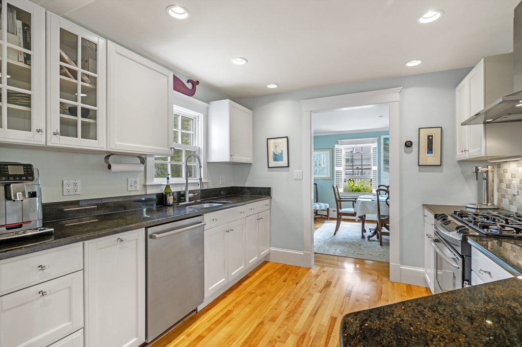 5 Gregory Street Marblehead, MA 01945 - Photo 10 of 29 a kitchen with stainless steel appliances granite countertop a stove a sink and a refrigerator