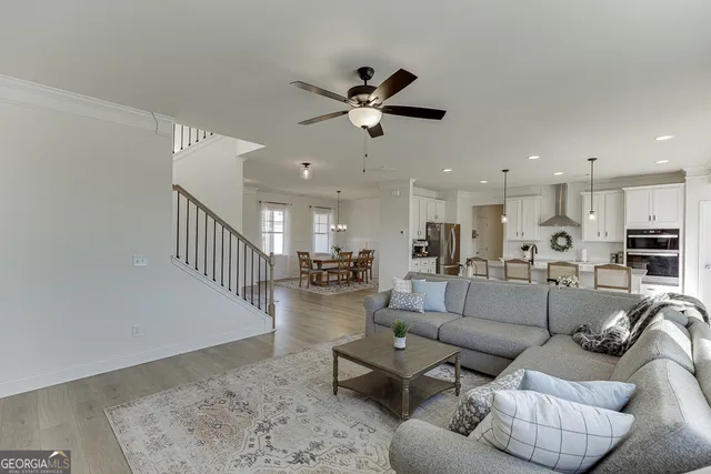 a large kitchen with kitchen island a table and chairs
