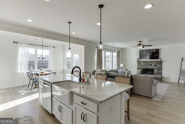 a dining room with furniture and window