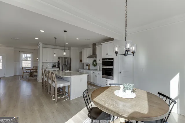 a bathroom with a sink mirror and toilet
