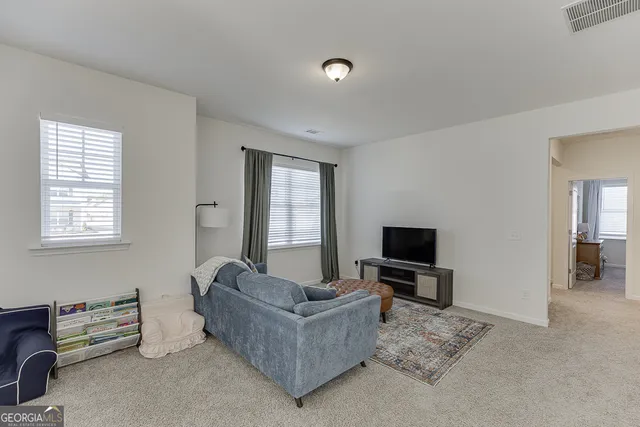 a living room with furniture and a couch