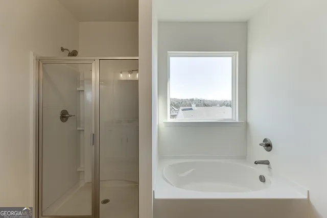 a view of living room with furniture and a flat screen tv