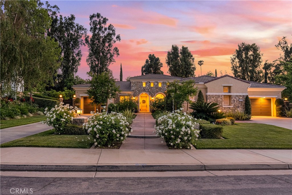 a front view of a house with garden
