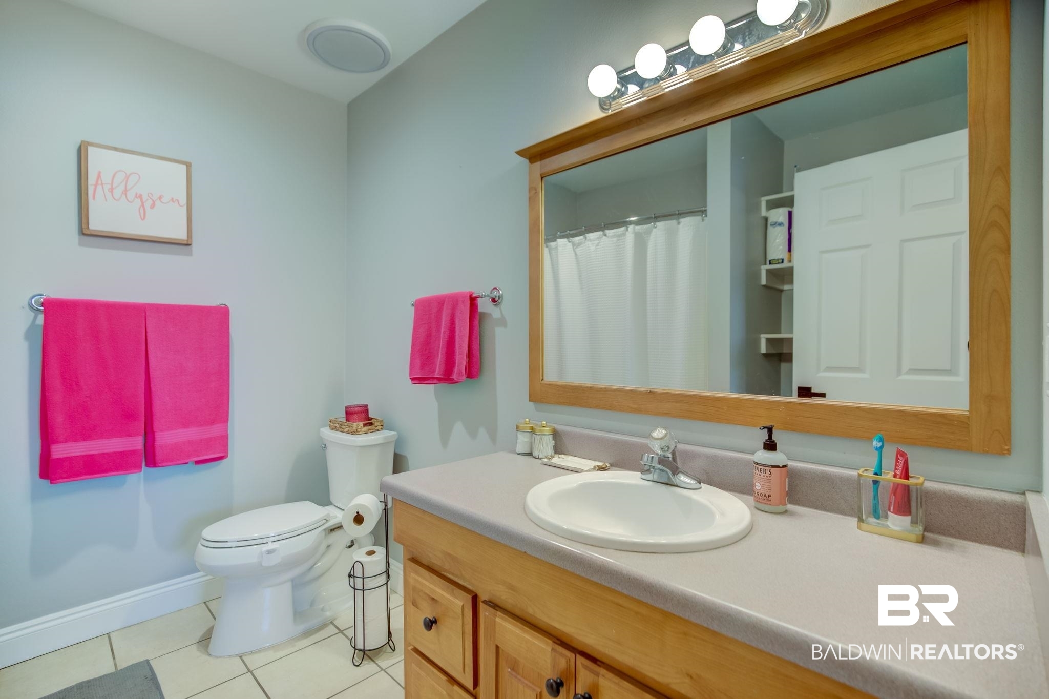 18732 Fairground Road Robertsdale, AL 36567 - Photo 30 of 46 Bathroom with tile patterned floors, vanity, and toilet