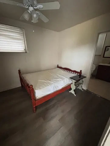 a bed sitting in a room next to a window