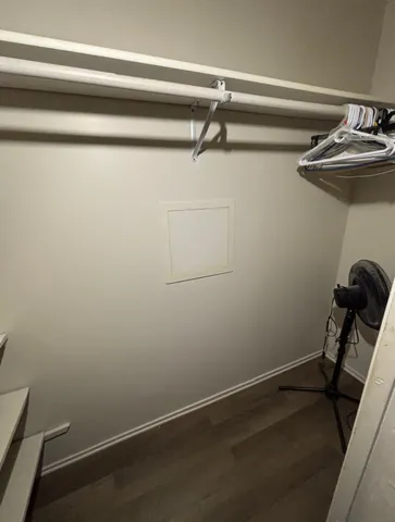 a view of a room with rack and wooden floor