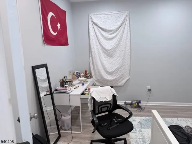 a bed sitting in a bedroom and table