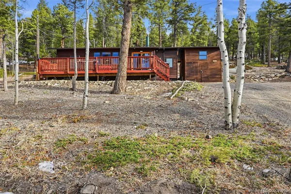 a view of balcony with wooden floor and fence