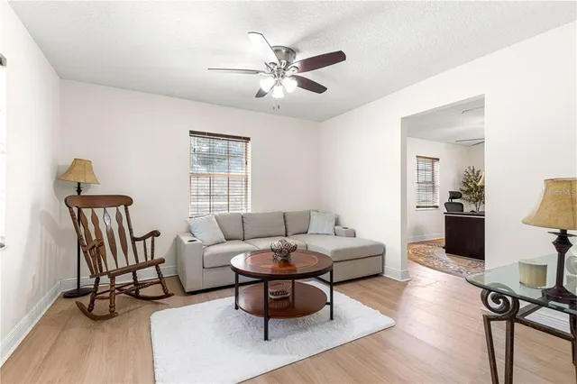 a bedroom with a bed window and a flat screen tv