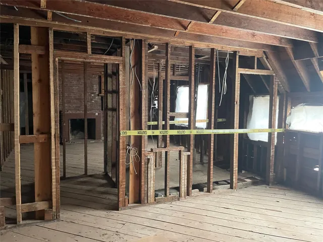 a view of a house with wooden floor and windows