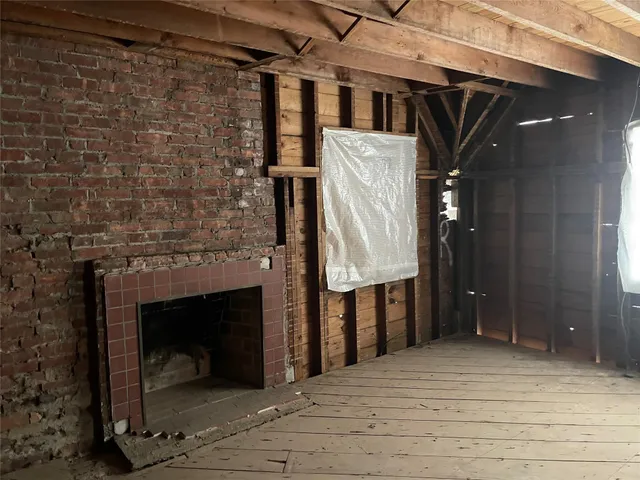 a view of entryway with a fireplace