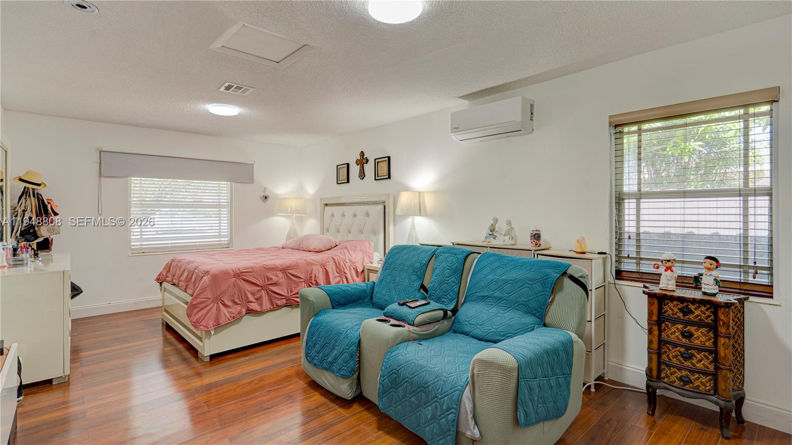 6815 Southwest 134th Court Miami, FL 33183 - Photo 18 of 53 a bedroom with a bed and wooden floor