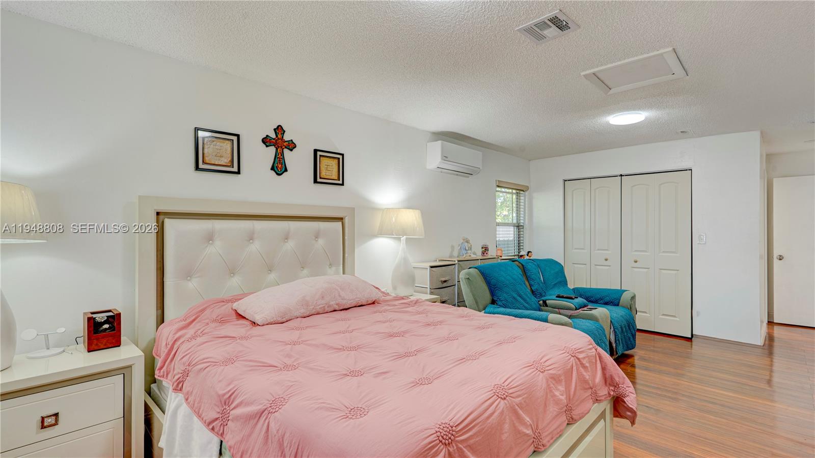 6815 Southwest 134th Court Miami, FL 33183 - Photo 19 of 53 a bedroom with a bed and wooden floor