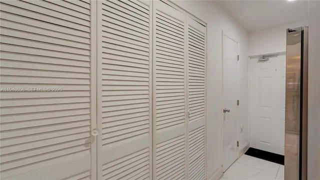 a view of a workspace with furniture and wooden floor