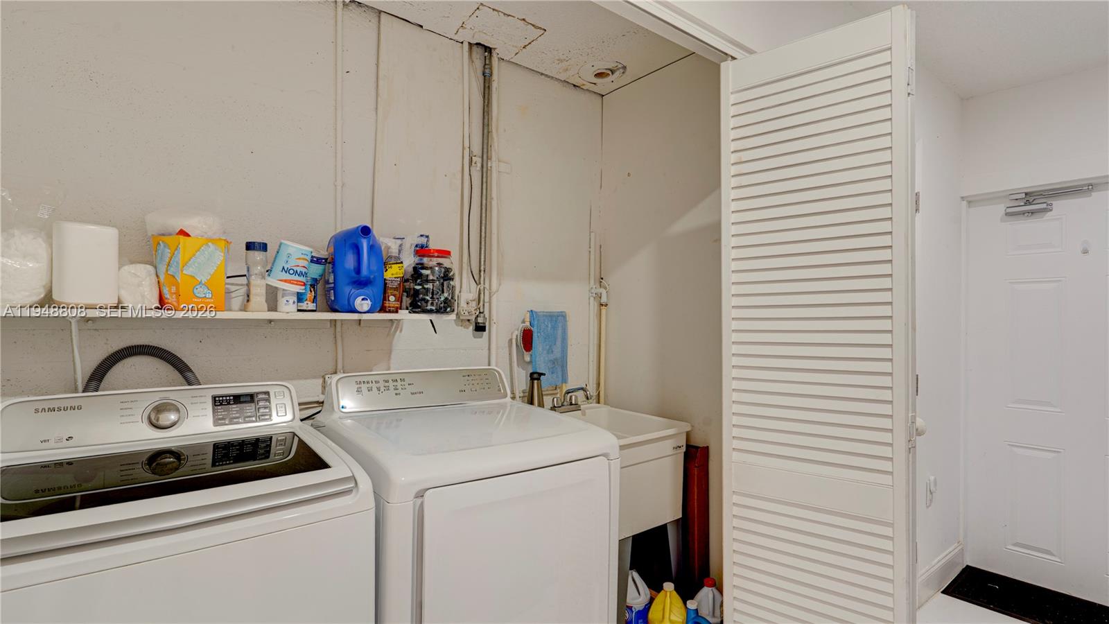 6815 Southwest 134th Court Miami, FL 33183 - Photo 22 of 53 a utility room with dryer and washer
