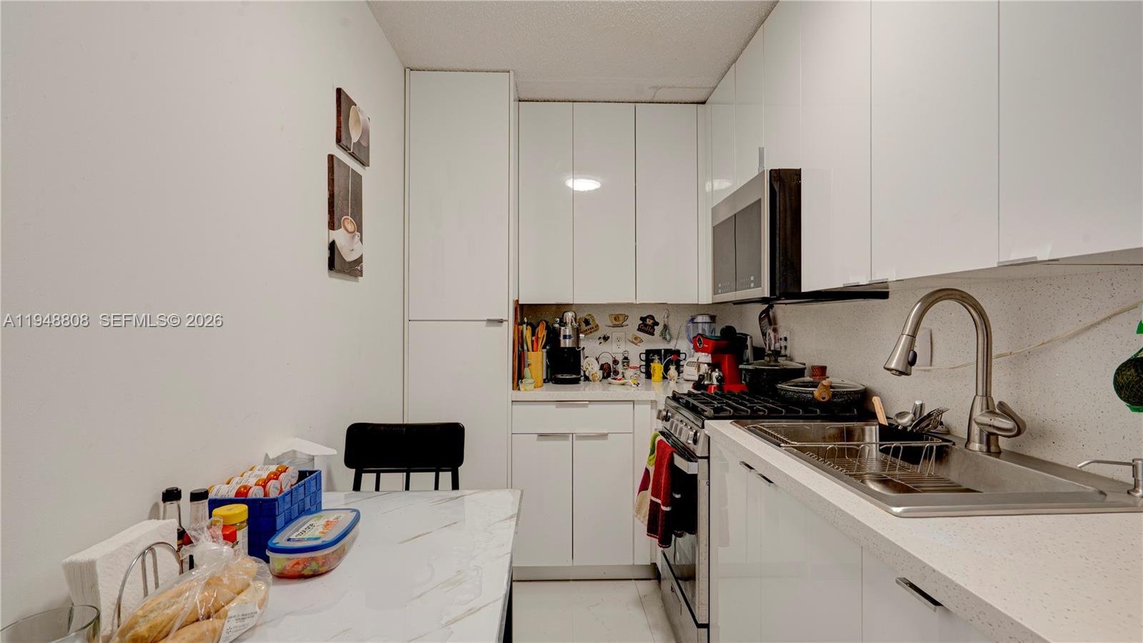 6815 Southwest 134th Court Miami, FL 33183 - Photo 24 of 53 a view of a kitchen with a sink and a refrigerator