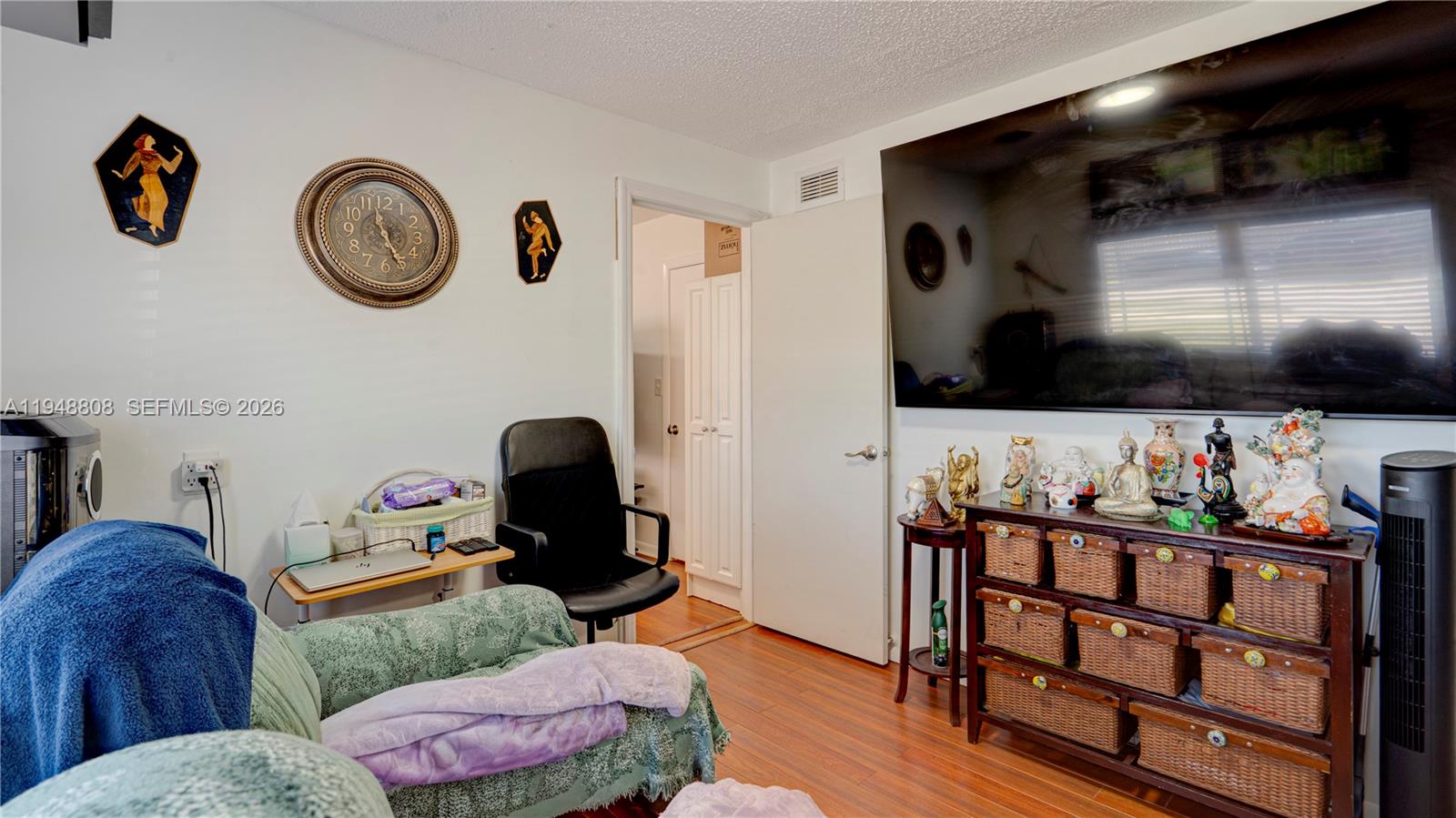 6815 Southwest 134th Court Miami, FL 33183 - Photo 26 of 53 a living room with furniture and a flat screen tv