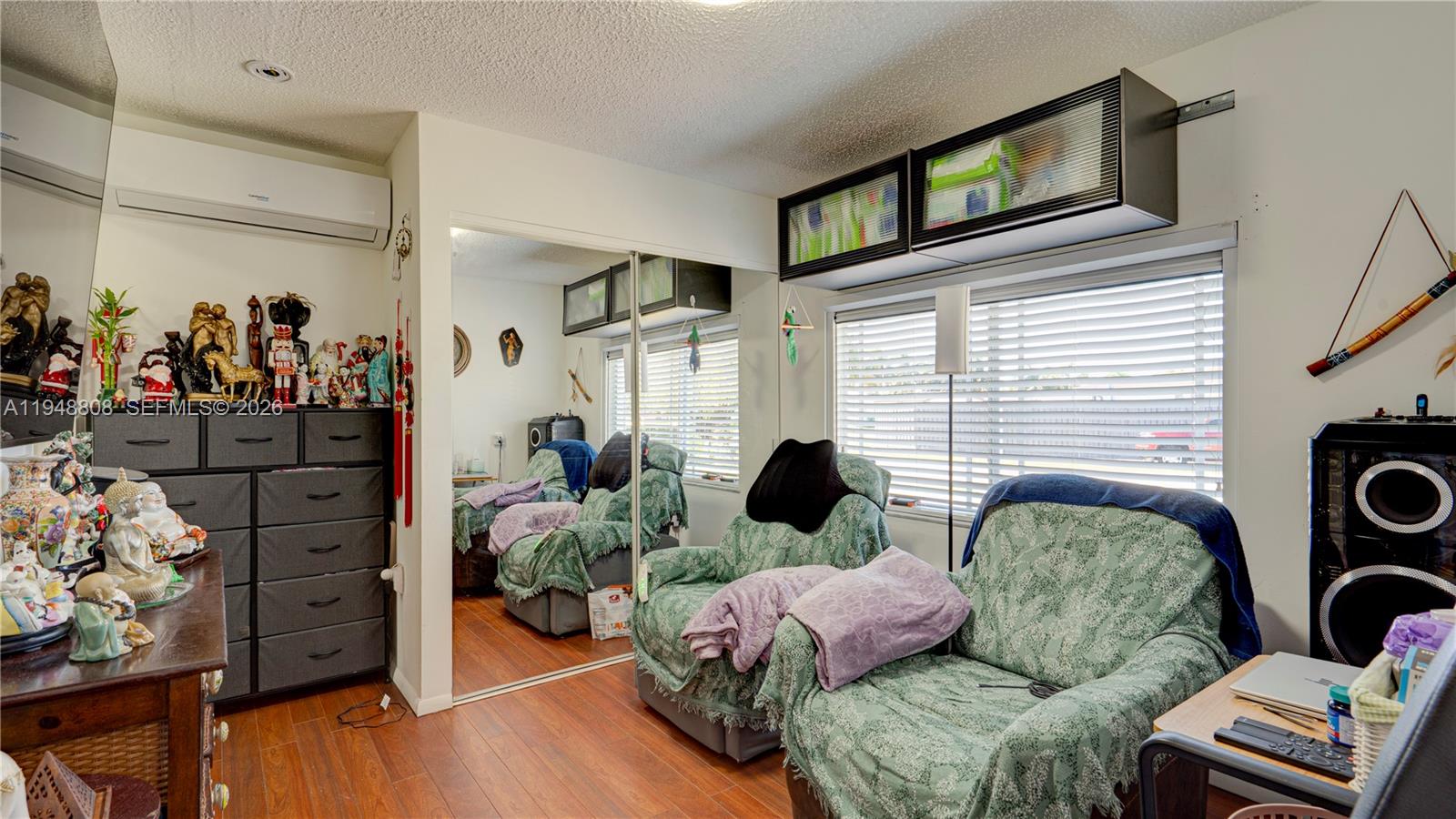 6815 Southwest 134th Court Miami, FL 33183 - Photo 27 of 53 a living room with furniture and a flat screen tv