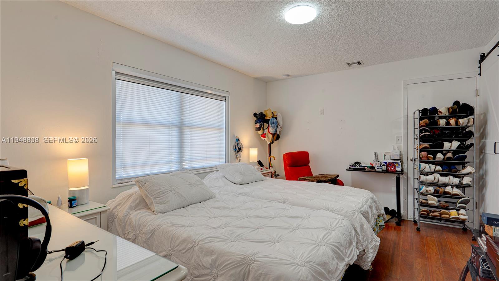 6815 Southwest 134th Court Miami, FL 33183 - Photo 28 of 53 a bedroom with a bed and a large window