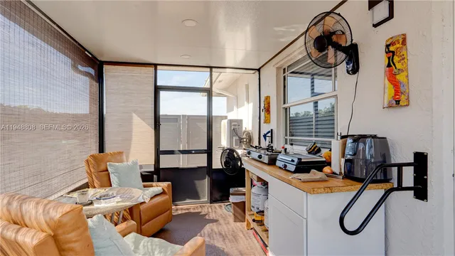 a view of a house with a yard and sitting area