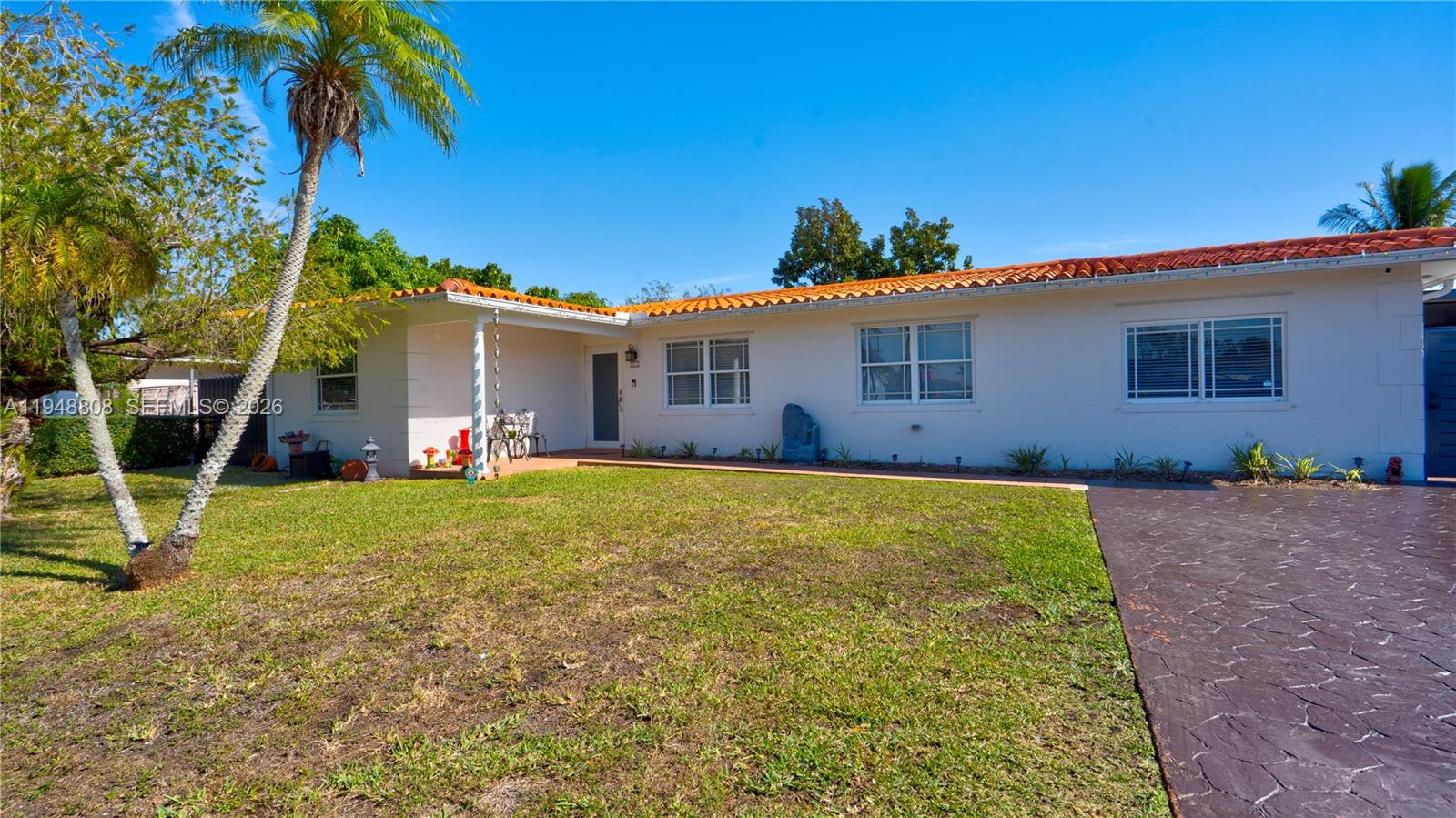6815 Southwest 134th Court Miami, FL 33183 - Photo 4 of 53 a view of a house with backyard and a tree