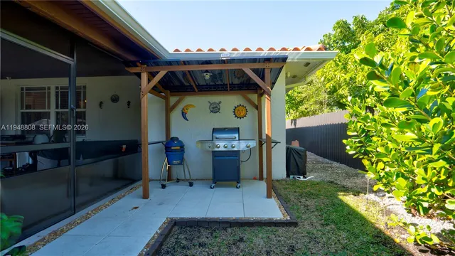 a view of a livingroom with furniture and a window