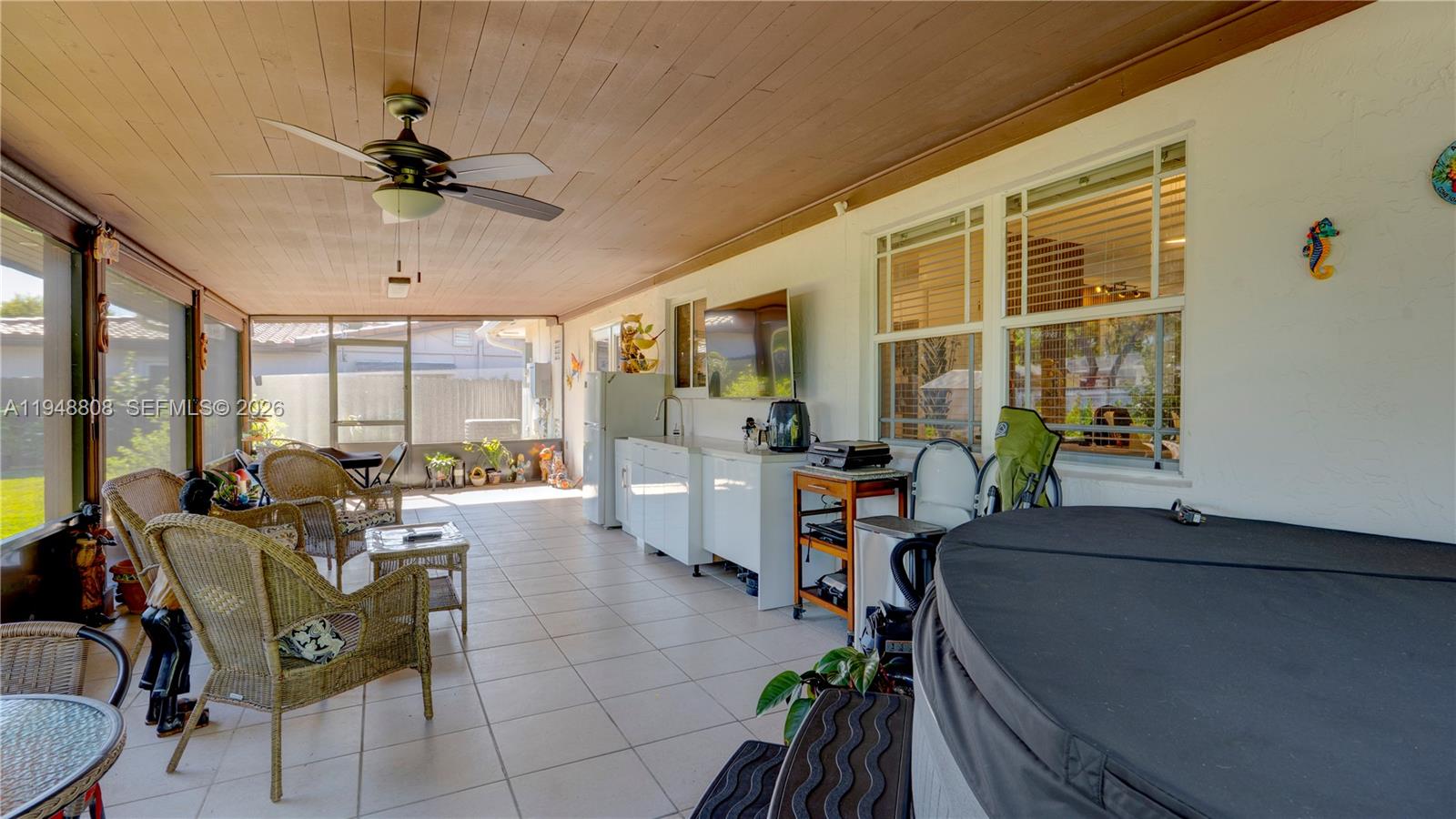 6815 Southwest 134th Court Miami, FL 33183 - Photo 44 of 53 a living room with patio furniture and a window