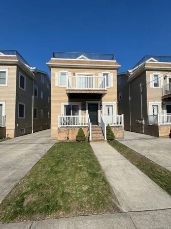 a view of a house with entrance gate