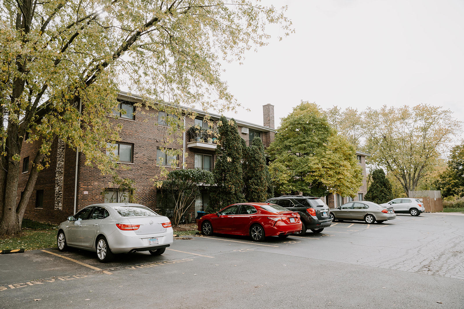 1220 South Lorraine Road, Unit 2C Wheaton, IL 60189 - Photo 14 of 14 a car parked in front of a house