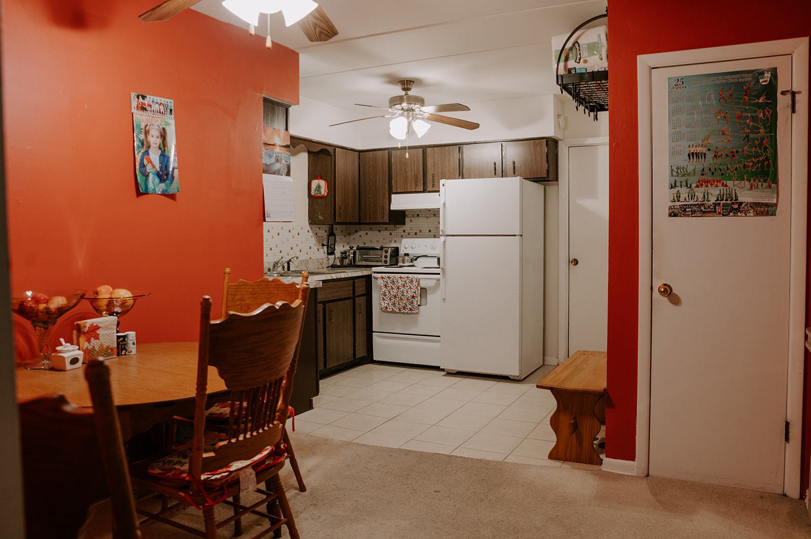 1220 South Lorraine Road, Unit 2C Wheaton, IL 60189 - Photo 3 of 14 a kitchen with a refrigerator a table and chairs in it