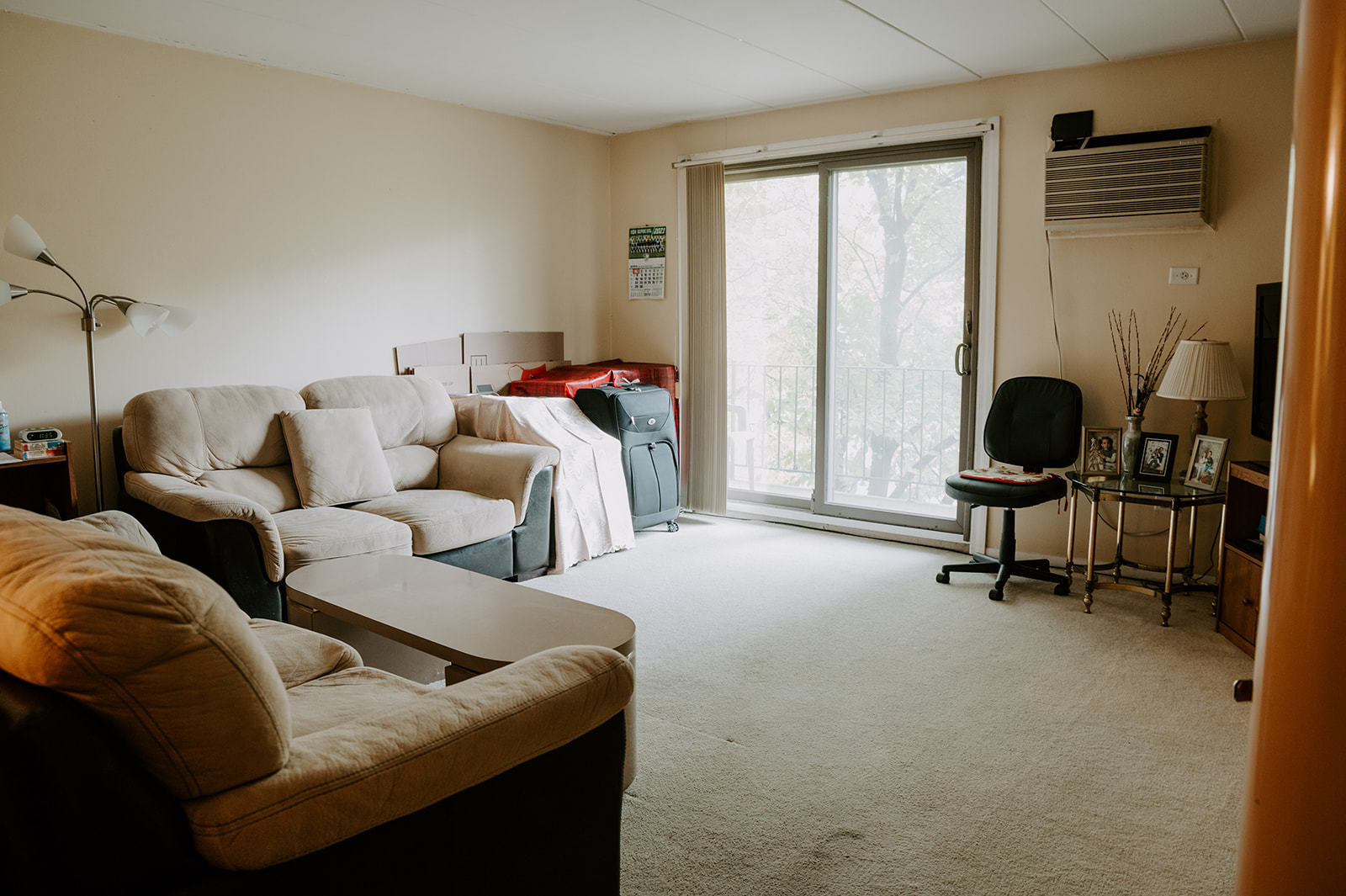 1220 South Lorraine Road, Unit 2C Wheaton, IL 60189 - Photo 8 of 14 a living room with furniture and large windows
