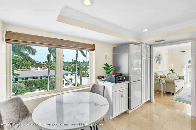 a kitchen with stainless steel appliances white cabinets and a sink