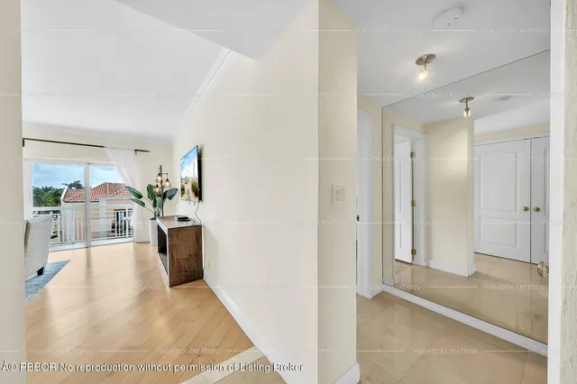 a view of living room with furniture and a large window