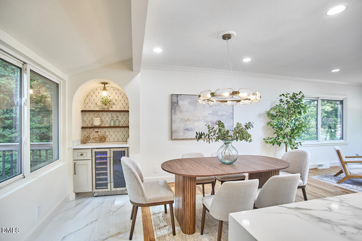1609 Acadia Street Durham, NC 27701 - Photo 14 of 56 a view of a dining room with furniture window and outside view