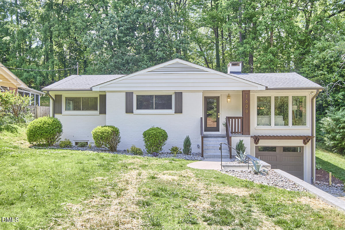 1609 Acadia Street Durham, NC 27701 - Photo 28 of 56 a front view of a house with a yard
