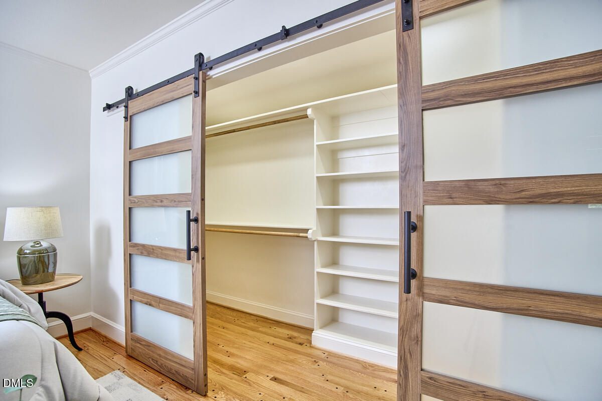 1609 Acadia Street Durham, NC 27701 - Photo 34 of 56 a view of walk in closet with empty racks