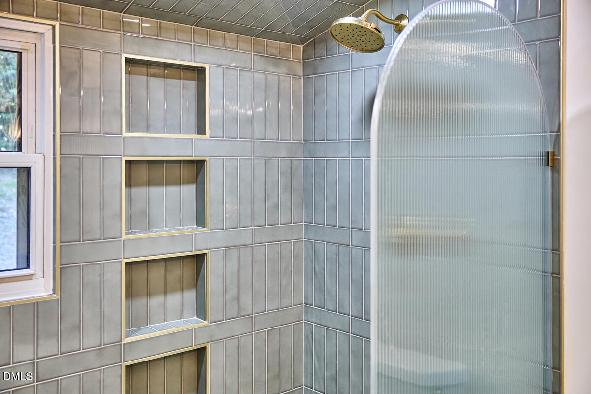 1609 Acadia Street Durham, NC 27701 - Photo 37 of 56 a bathroom with a sink and mirror