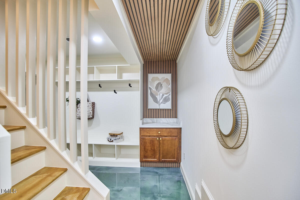 1609 Acadia Street Durham, NC 27701 - Photo 40 of 56 a bathroom with a sink a mirror and a shower
