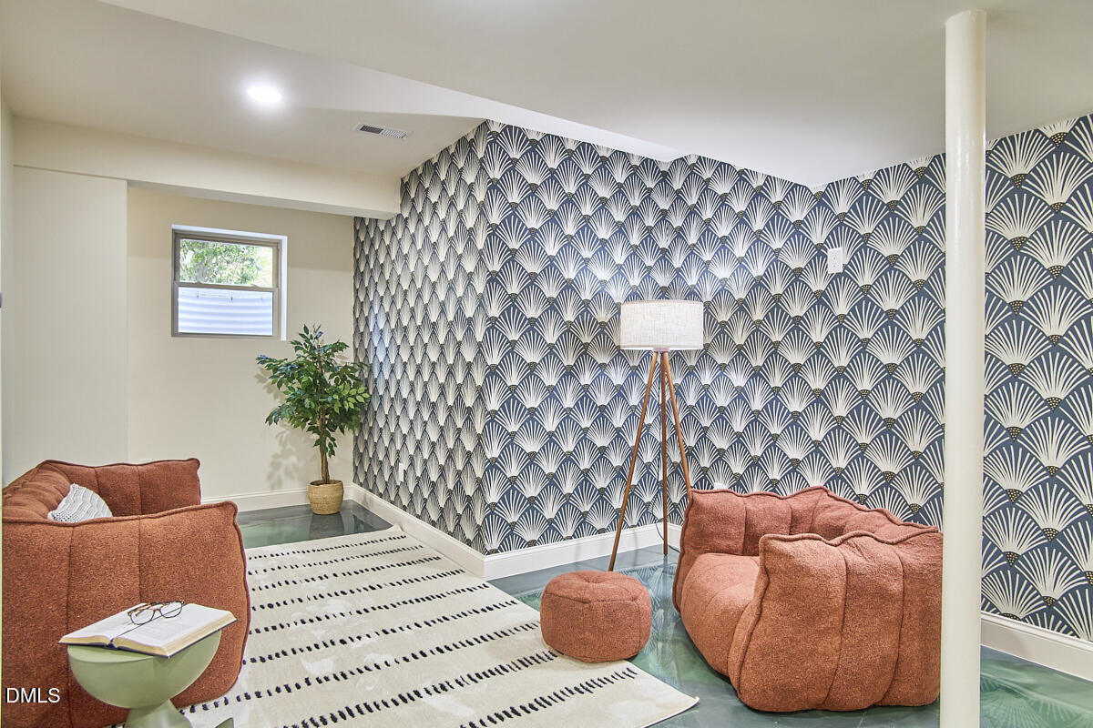 1609 Acadia Street Durham, NC 27701 - Photo 43 of 56 a living room with furniture and a potted plant