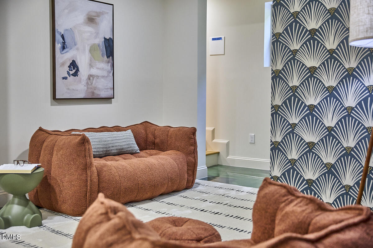 1609 Acadia Street Durham, NC 27701 - Photo 44 of 56 a bedroom with a bed and a painting on the wall