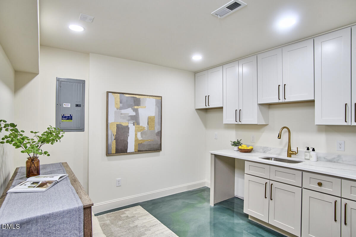 1609 Acadia Street Durham, NC 27701 - Photo 45 of 56 a kitchen with a refrigerator and sink