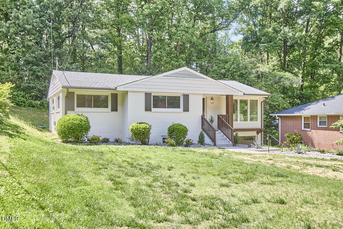 1609 Acadia Street Durham, NC 27701 - Photo 51 of 56 a view of a house with a yard