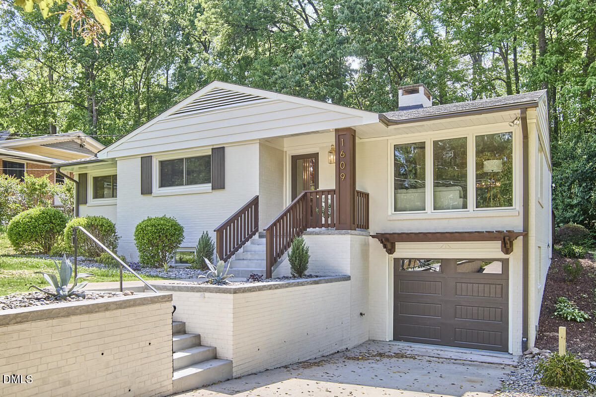 1609 Acadia Street Durham, NC 27701 - Photo 52 of 56 a front view of a house with large windows